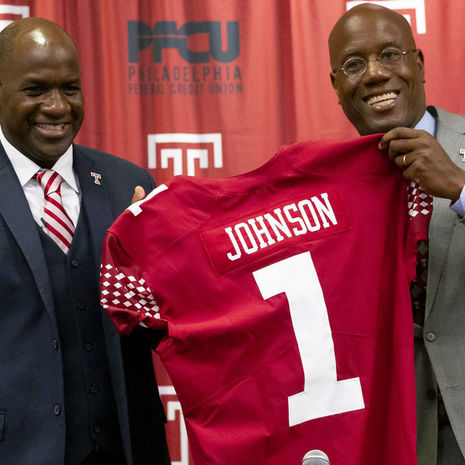 Arthur Johnson pictured with President Wingard, holding Johnson's replica Temple jersey.