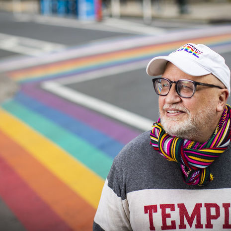 Scott Gratson standing at the rainbow crosswalks on 13th and Locust in Philadelphia