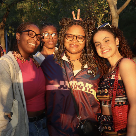 A group of students smiling brightly