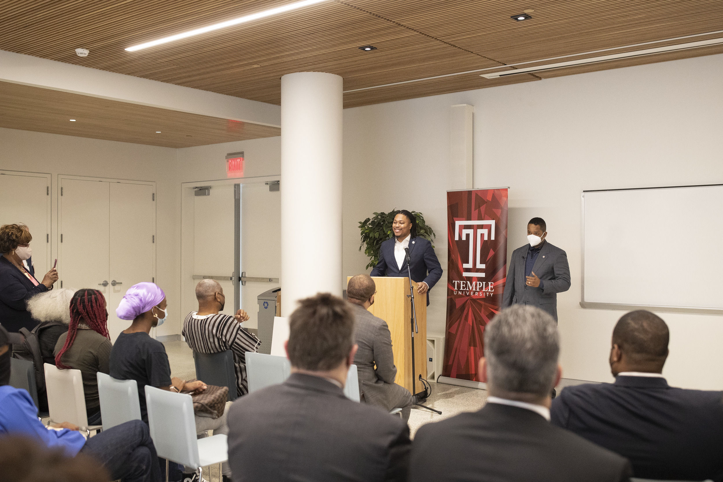 A man stands at a podium while speaking.